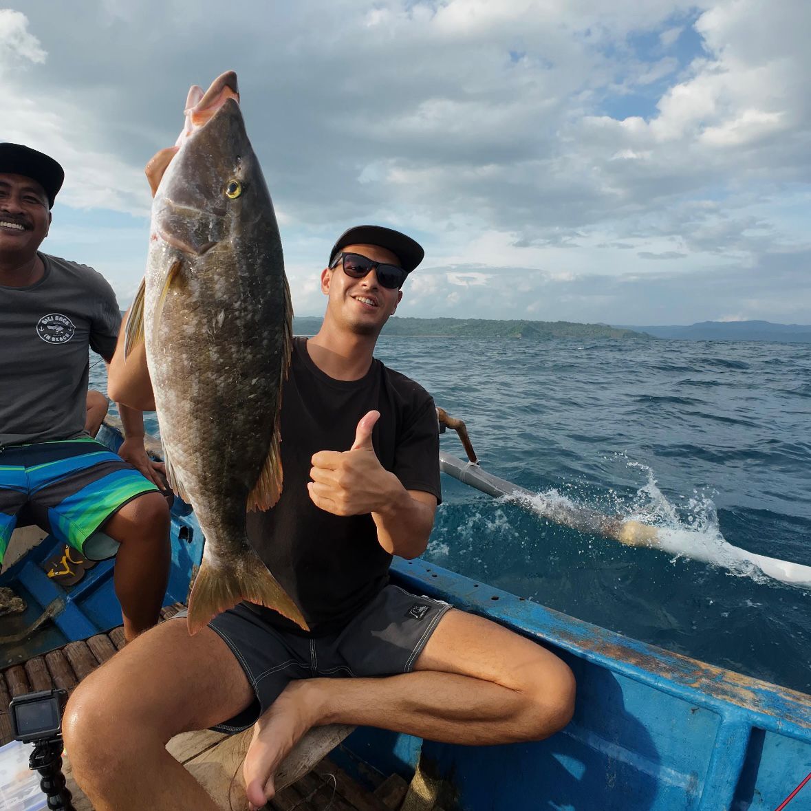 Proud angler with a big grouper catch