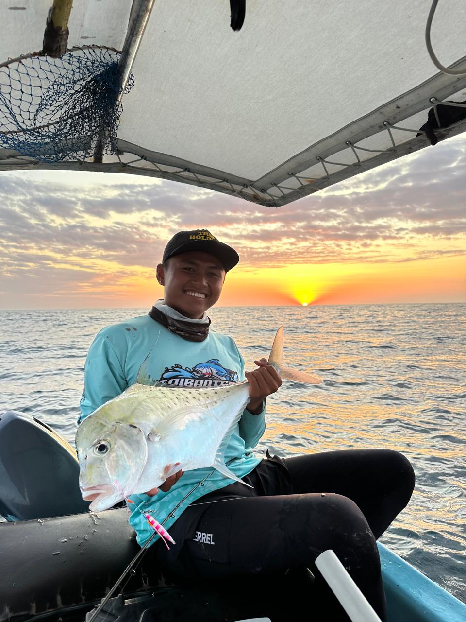 Crew with catch at sunset