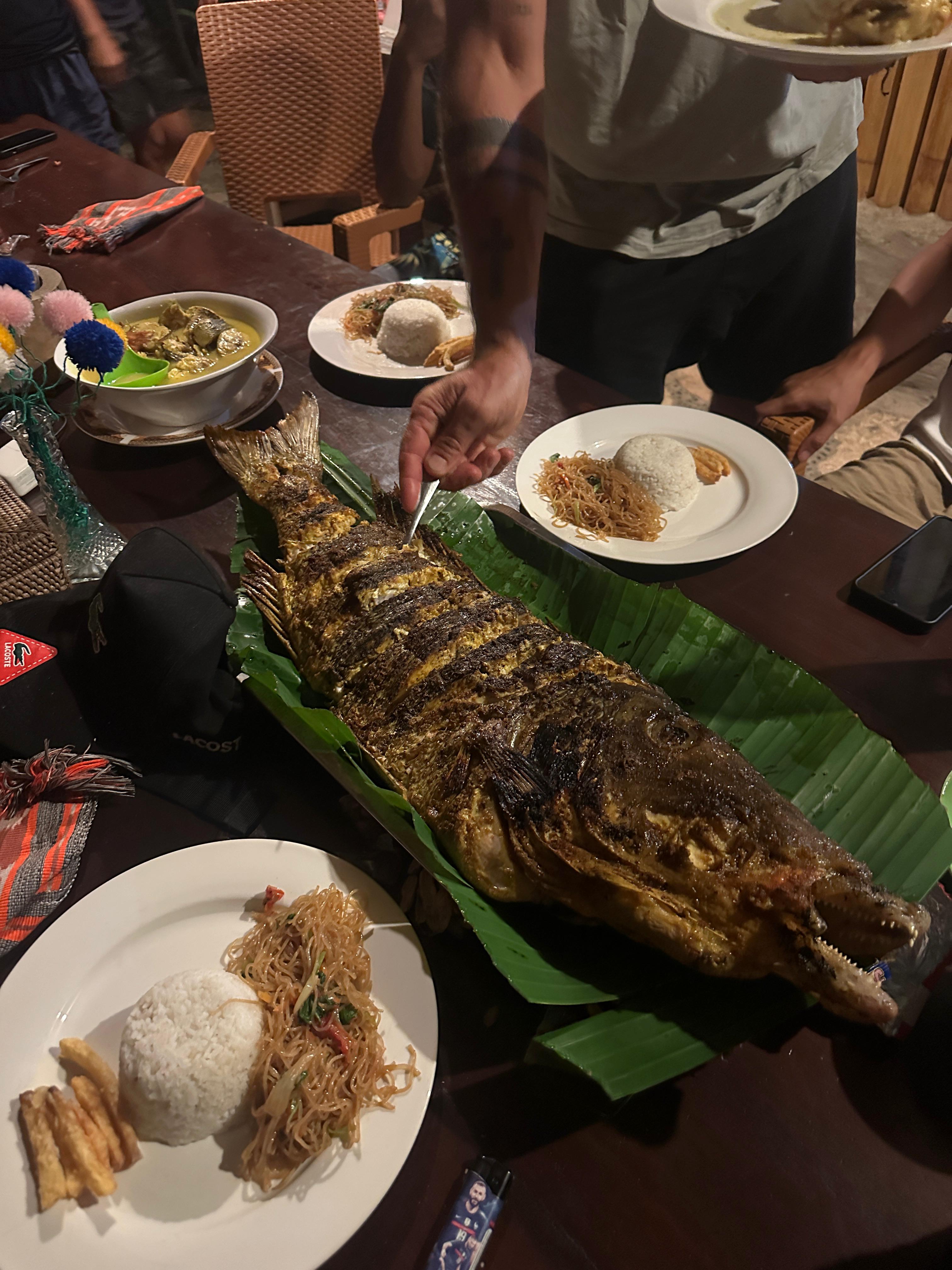 Shared BBQ dinner table by the beach